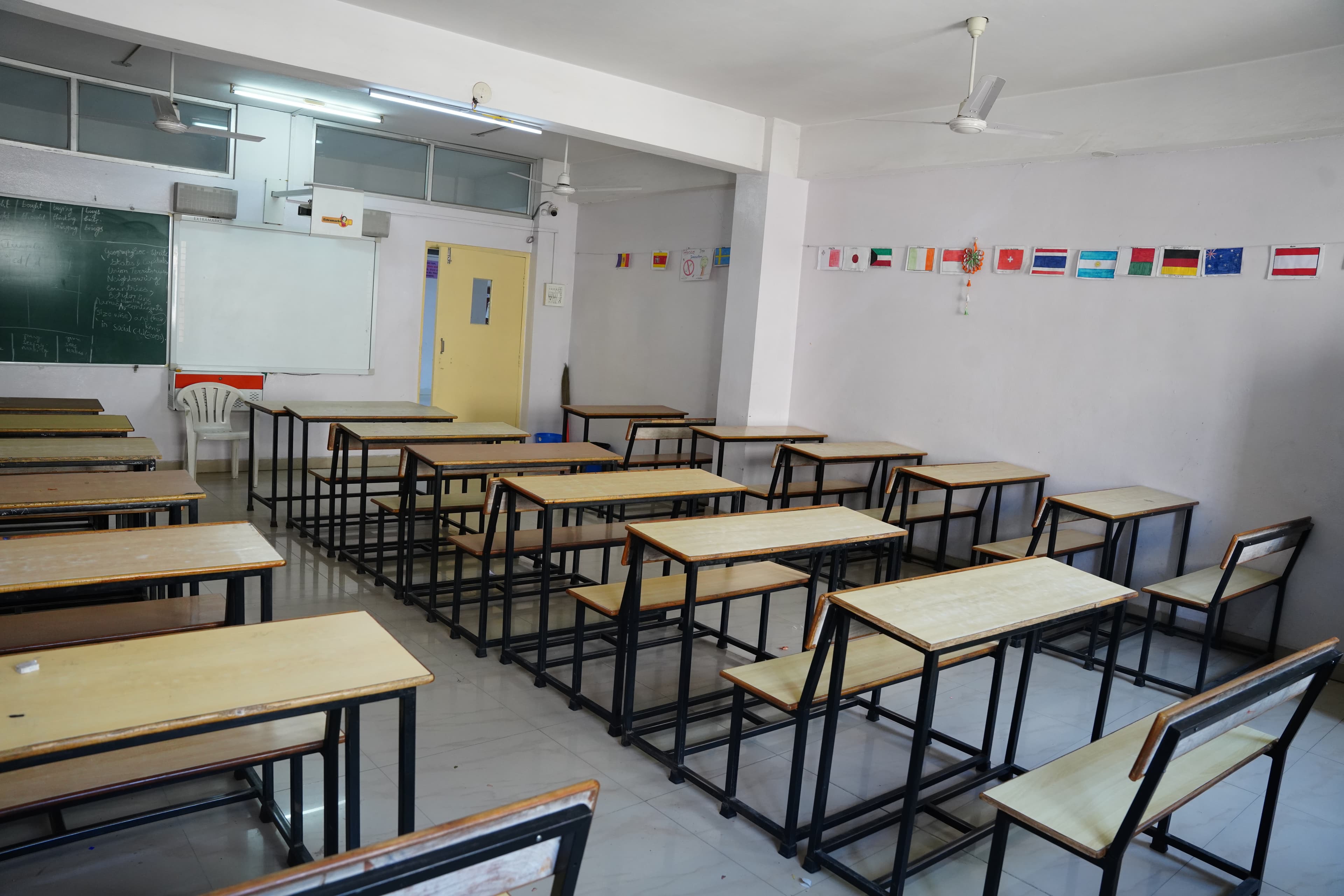 Classroom reverse angle with whiteboard and CCTV