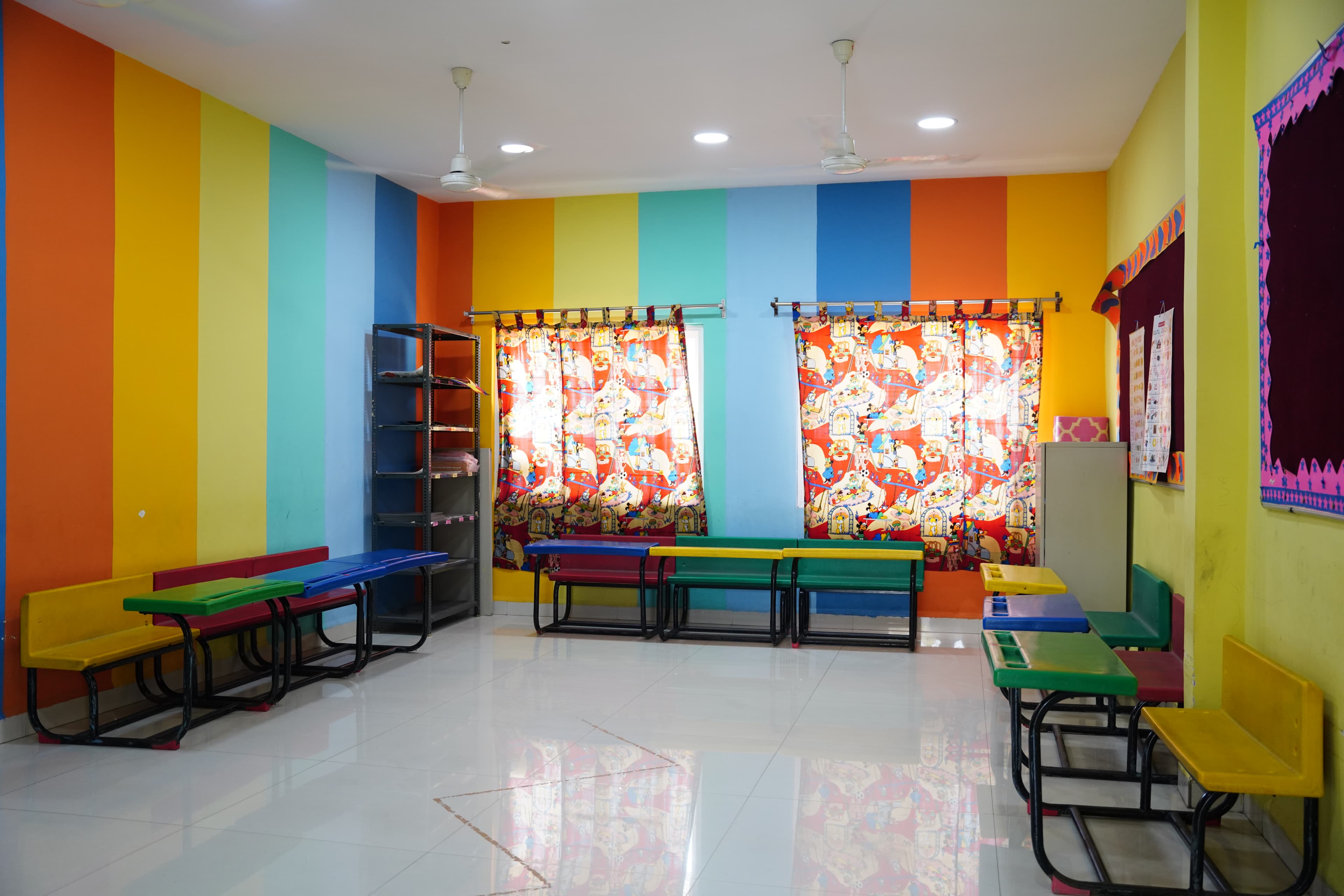 Pre-primary classroom with rainbow striped walls